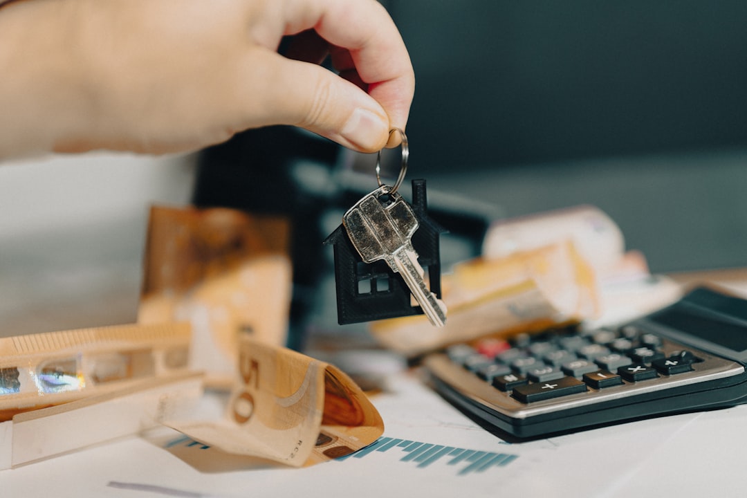 portfolio-08 hand holding door keys real estate market home finance calculator documents analytics charts